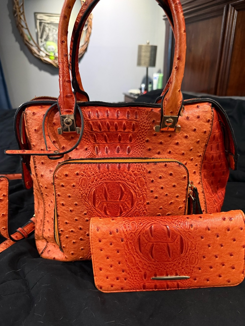 Orange ostrich purse with matching clutch
